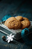 A tin of gingerbread biscuits to be given as a gift