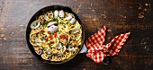Spaghetti alle Vongole Seafood pasta with clams on black iron pan