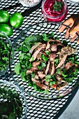A large bowl of Thai Grilled Beef and Herb Salad