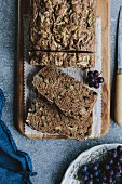 A loaf of sliced zucchini and walnut bread