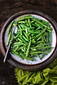 Green beans with onion and sesame seeds in a dish
