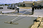 Workers Smoothing Concrete