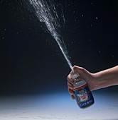 Club soda being opened with spray