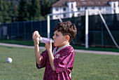 Boy Using Inhaler