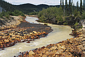 Polluted rocks and stream,Canada