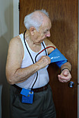 Man Wearing a Blood Pressure Monitor