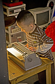 Boy using Braille Typewriter