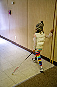Blind Child Walking down Hallway