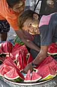 Street Vendors Selling Sliced Watermelon