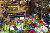 Woman Selling Fresh Vegetables and Eggs