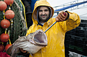 Fisherman holds Goosefish