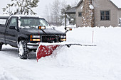 Plowing Through Winter Snowstorm