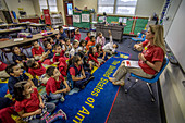 Volunteer Teacher Reading to Children