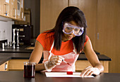 Student using Hydrochloric Acid