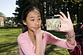 Pre-teen Girl Examining Nature