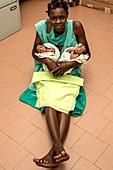 Mother and twin babies in hospital