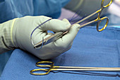 Needle driver and suture