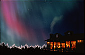 Aurora borealis or northern lights over a home