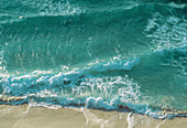 Waves breaking on a sandy beach