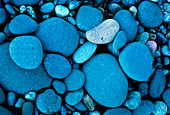 Close-up of rounded pebbles on a shoreline