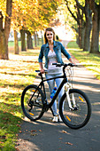 Woman holding a bicycle