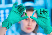 Scientist holding eppendorf tubes