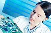 Female electrical engineer with circuit