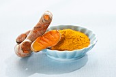 Fresh turmeric root and dried powder