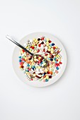 Plate with pills and spoon