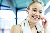 Woman adjusting headphones