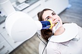 Young woman having dental x-ray