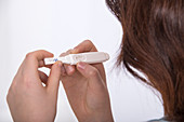 Teenage girl doing a pregnancy test