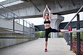 Woman doing yoga in sports wear