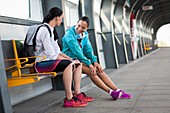 Women sitting on railway platform