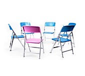 Circle of blue chairs with one pink chair