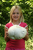 Girl holding a Giant Puffball Mushroom