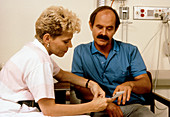 AIDS patient in discussion with social worker