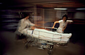 Emergency care: patient wheeled through hospital
