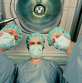 Patient's eye view of three surgeons