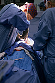 Surgeon Using Rongeur