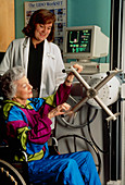 Physiotherapy: elderly woman exercising arms