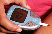 Diabetic Child with Blood Glucose Tester