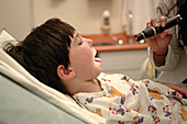 Boy Having Tonsils Examined