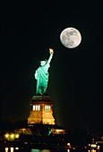 Full moon over The Statue of Liberty