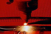 Industrial laser cutting holes in Kevlar-epoxy