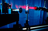 Laser on optical bench in laboratory