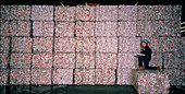stacks of crushed aluminium cans for recycling
