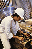 Engineer setting up turbo-visory equipment