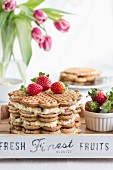A waffle cake with advocaat cream and strawberries