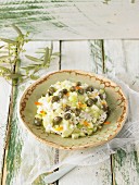 Cucumber salad with cashew cream, capers and marigold flowers